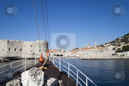 To use this stock image in your creative project, please select the size you need over to the right and click the "Add to Cart" button.
Your downloaded image will come with the Cutcaster watermark removed so don’t worry about the watermark you see on this page. Bow of Ship stock photo, The bow of a ship with a blue sky beyond by Kevin Tietz