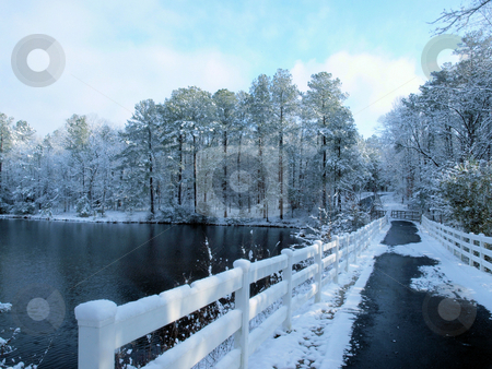 To use this stock image in your creative project, please select the size you need over to the right and click the "Add to Cart" button.
Your downloaded image will come with the Cutcaster watermark removed so don’t worry about the watermark you see on this page. Bridge over winter lake stock photo, A bridge over a lake during the winter time. by Tim Markley