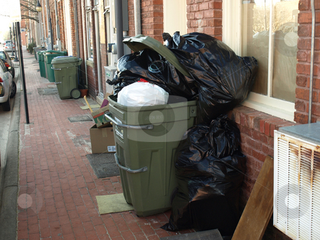 To use this stock image in your creative project, please select the size you need over to the right and click the "Add to Cart" button.
Your downloaded image will come with the Cutcaster watermark removed so don’t worry about the watermark you see on this page. Trash in the alley stock photo, A trsh can filled and waiting for pickup by Tim Markley