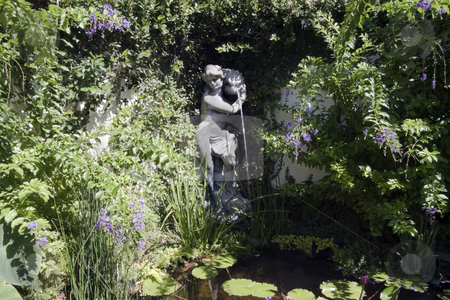 To use this stock image in your creative project, please select the size you need over to the right and click the "Add to Cart" button.
Your downloaded image will come with the Cutcaster watermark removed so don’t worry about the watermark you see on this page. Pond Statue stock photo, A statue pouring water into a pond by Kevin Tietz