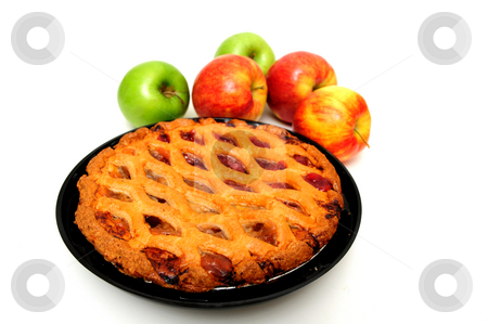 To use this stock image in your creative project, please select the size you need over to the right and click the "Add to Cart" button.
Your downloaded image will come with the Cutcaster watermark removed so don’t worry about the watermark you see on this page. Apple Pie stock photo, Fresh apple pie with red and green apples on a white background by Lynn Bendickson