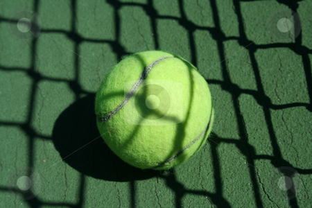 To use this stock image in your creative project, please select the size you need over to the right and click the "Add to Cart" button.
Your downloaded image will come with the Cutcaster watermark removed so don’t worry about the watermark you see on this page. Tennis ball near net stock photo, A Tennis ball near net with showdows by Jim Mills