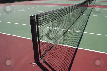 To use this stock image in your creative project, please select the size you need over to the right and click the "Add to Cart" button.
Your downloaded image will come with the Cutcaster watermark removed so don’t worry about the watermark you see on this page. Tennis Court stock photo, A empty green Tennis Court with net by Jim Mills