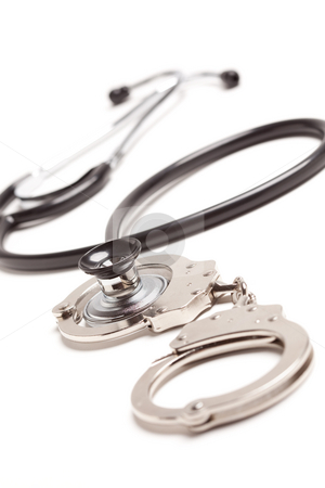 To use this stock image in your creative project, please select the size you need over to the right and click the "Add to Cart" button.
Your downloaded image will come with the Cutcaster watermark removed so don’t worry about the watermark you see on this page. Stethoscope and Handcuffs on White stock photo, Stethoscope and Handcuffs Isolated on a White Background. by Andy Dean