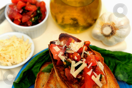 To use this stock image in your creative project, please select the size you need over to the right and click the "Add to Cart" button.
Your downloaded image will come with the Cutcaster watermark removed so don’t worry about the watermark you see on this page. Bruschetta And Olive Oil stock photo, Bruschetta on a turquoise plate with toasted baguette slices and more tomato, basil, garlic and olive oil including grated asiago cheese in a small white containers by Lynn Bendickson