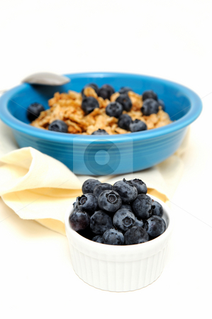 To use this stock image in your creative project, please select the size you need over to the right and click the "Add to Cart" button.
Your downloaded image will come with the Cutcaster watermark removed so don’t worry about the watermark you see on this page. Blueberries And Cereal stock photo, Bowl of cold breakfast cereal with fresh blueberries on a white background by Lynn Bendickson