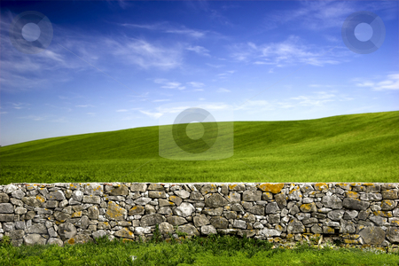 To use this stock image in your creative project, please select the size you need over to the right and click the "Add to Cart" button.
Your downloaded image will come with the Cutcaster watermark removed so don’t worry about the watermark you see on this page. Stone wall stock photo, Beautiful green meadow with a old Stone wall by ikostudio