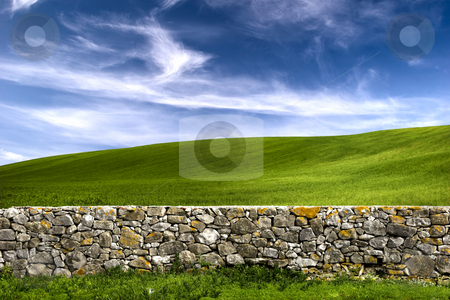 To use this stock image in your creative project, please select the size you need over to the right and click the "Add to Cart" button.
Your downloaded image will come with the Cutcaster watermark removed so don’t worry about the watermark you see on this page. Stone wall stock photo, Beautiful green meadow with a old Stone wall by ikostudio