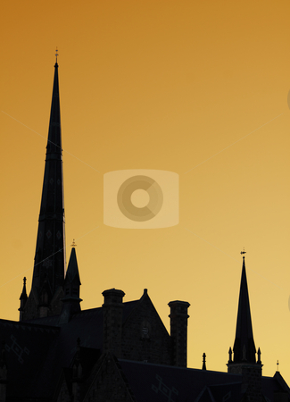 To use this stock image in your creative project, please select the size you need over to the right and click the "Add to Cart" button.
Your downloaded image will come with the Cutcaster watermark removed so don’t worry about the watermark you see on this page. Church Steeples stock photo, The spires of a cathedral against an orange sky. by Chris Hill