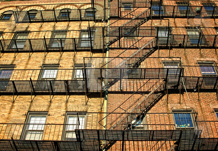 To use this stock image in your creative project, please select the size you need over to the right and click the "Add to Cart" button.
Your downloaded image will come with the Cutcaster watermark removed so don’t worry about the watermark you see on this page. Wide escape stock photo, Fire escapes on old tenament buildings in boston massachusetts against a blue sky by Stephen Orsillo