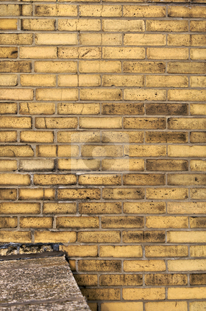 To use this stock image in your creative project, please select the size you need over to the right and click the "Add to Cart" button.
Your downloaded image will come with the Cutcaster watermark removed so don’t worry about the watermark you see on this page. Yellow brick wall stock photo, Yellow brick wall background with ledge of cement connected to it by Stephen Orsillo