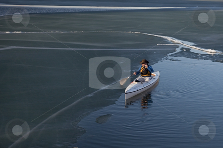 To use this stock image in your creative project, please select the size you need over to the right and click the "Add to Cart" button.
Your downloaded image will come with the Cutcaster watermark removed so don’t worry about the watermark you see on this page. Canoe paddling on ice covered lake stock photo, Paddling decked expedition canoe on a lake covered with dark soft ice, early spring by Marek Uliasz
