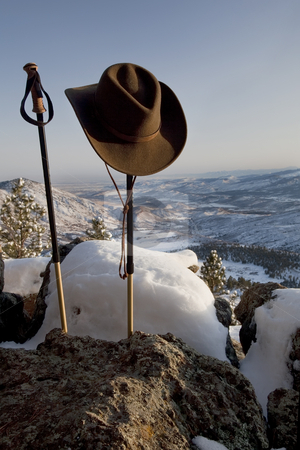 To use this stock image in your creative project, please select the size you need over to the right and click the "Add to Cart" button.
Your downloaded image will come with the Cutcaster watermark removed so don’t worry about the watermark you see on this page. Trekking poles and hat in mountain scenery stock photo, Trekking poles and cowboy style hat in winter mountain scenery, Front Range of Rocky Mountains near Fort Collins, Colorado by Marek Uliasz
