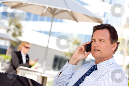 To use this stock image in your creative project, please select the size you need over to the right and click the "Add to Cart" button.
Your downloaded image will come with the Cutcaster watermark removed so don’t worry about the watermark you see on this page. Businessman Smiles as He Talks on His Cell Phone stock photo, Confident, Handsome Businessman Smiles as He Talks on His Cell Phone. by Andy Dean