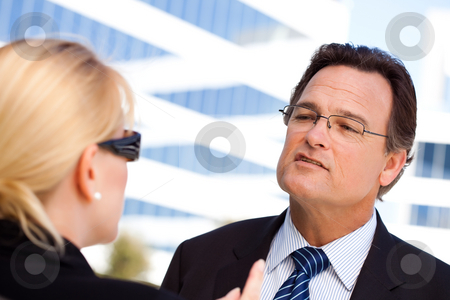 To use this stock image in your creative project, please select the size you need over to the right and click the "Add to Cart" button.
Your downloaded image will come with the Cutcaster watermark removed so don’t worry about the watermark you see on this page. Businessman Talking with Female Colleague stock photo, Attentive, Handsome Businessman in Suit and Tie Talking with Female Colleague Outdoors. by Andy Dean