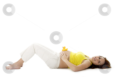 To use this stock image in your creative project, please select the size you need over to the right and click the "Add to Cart" button.
Your downloaded image will come with the Cutcaster watermark removed so don’t worry about the watermark you see on this page. Pregnancy stock photo, Beautiful pregnant woman with a rubber duck on her tummy by ikostudio