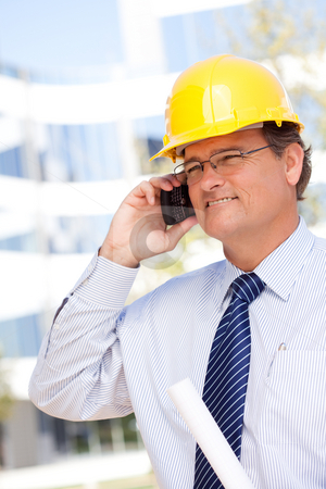 To use this stock image in your creative project, please select the size you need over to the right and click the "Add to Cart" button.
Your downloaded image will come with the Cutcaster watermark removed so don’t worry about the watermark you see on this page. Contractor in Hardhat and Necktie Talks on His Cell Phone stock photo, Handsome Contractor in Hardhat and Necktie Smiles as He Talks on His Cell Phone. by Andy Dean