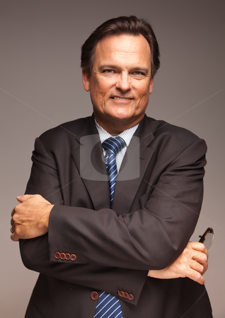 To use this stock image in your creative project, please select the size you need over to the right and click the "Add to Cart" button.
Your downloaded image will come with the Cutcaster watermark removed so don’t worry about the watermark you see on this page. Handsome Businessman Portrait on White stock photo, Handsome Businessman Smiling in Suit and Tie Isolated on a Grey Background. by Andy Dean