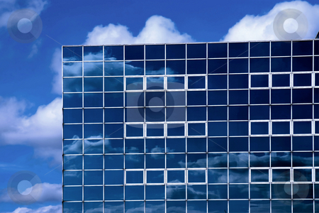 To use this stock image in your creative project, please select the size you need over to the right and click the "Add to Cart" button.
Your downloaded image will come with the Cutcaster watermark removed so don’t worry about the watermark you see on this page. Modern glass office stock photo, The corner of a glass office block reflecting the sky and clouds. by Paul Phillips