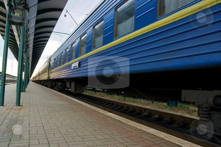 To use this stock image in your creative project, please select the size you need over to the right and click the "Add to Cart" button.
Your downloaded image will come with the Cutcaster watermark removed so don’t worry about the watermark you see on this page. Train stock photo, Wide angle view of a blue passenger train by P?