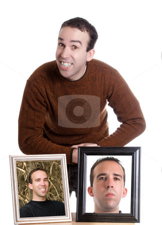 To use this stock image in your creative project, please select the size you need over to the right and click the "Add to Cart" button.
Your downloaded image will come with the Cutcaster watermark removed so don’t worry about the watermark you see on this page. Self Portrait stock photo, A young man is smiling and standing next to self portraits of himself, isolated against a white background by Richard Nelson