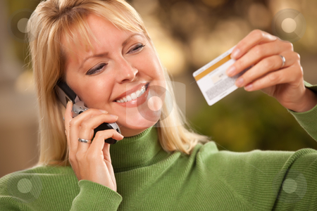 To use this stock image in your creative project, please select the size you need over to the right and click the "Add to Cart" button.
Your downloaded image will come with the Cutcaster watermark removed so don’t worry about the watermark you see on this page. Cheerful Woman Using Her Phone with Credit Card stock photo, Cheerful Smiling Woman Using Her Phone with Credit Card in Hand. by Andy Dean