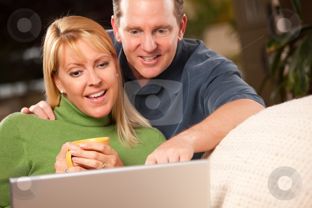 To use this stock image in your creative project, please select the size you need over to the right and click the "Add to Cart" button.
Your downloaded image will come with the Cutcaster watermark removed so don’t worry about the watermark you see on this page. Handsome Couple Using Laptop stock photo, Handsome Happy Couple Using Their Laptop Together. by Andy Dean