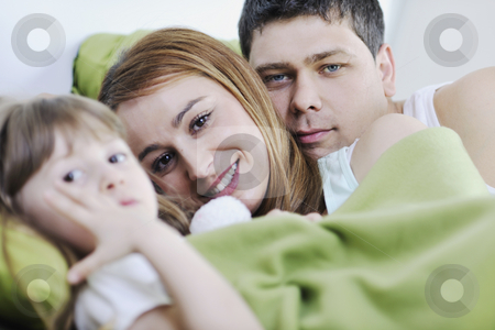 To use this stock image in your creative project, please select the size you need over to the right and click the "Add to Cart" button.
Your downloaded image will come with the Cutcaster watermark removed so don’t worry about the watermark you see on this page. Happy family relaxing in bed stock photo, Happy young family relaxing in bed by Benis Arapovic