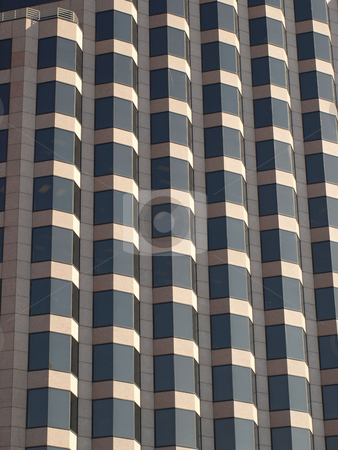 To use this stock image in your creative project, please select the size you need over to the right and click the "Add to Cart" button.
Your downloaded image will come with the Cutcaster watermark removed so don’t worry about the watermark you see on this page. Glass and brick stock photo, A brown glass and brick office building in North Carolina by Tim Markley