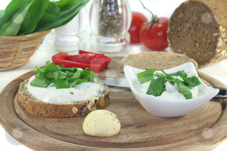 To use this stock image in your creative project, please select the size you need over to the right and click the "Add to Cart" button.
Your downloaded image will come with the Cutcaster watermark removed so don’t worry about the watermark you see on this page. Cottage cheese bread with wild garlic stock photo, A slice of bread with cottage cheese and freshly chopped wild garlic by Marén Wischnewski