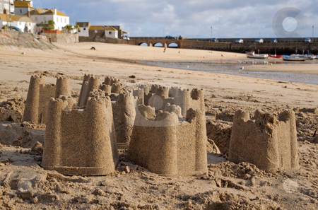 To use this stock image in your creative project, please select the size you need over to the right and click the "Add to Cart" button.
Your downloaded image will come with the Cutcaster watermark removed so don’t worry about the watermark you see on this page. Sandcastles on St. Ives harbour beach, Cornwall UK. stock photo, Sandcastles on St. Ives harbour beach, Cornwall UK. by Stephen Rees