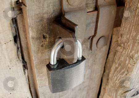 To use this stock image in your creative project, please select the size you need over to the right and click the "Add to Cart" button.
Your downloaded image will come with the Cutcaster watermark removed so don’t worry about the watermark you see on this page. Padlock stock photo, Padlock on an old wooden barn door by P?