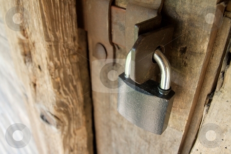 To use this stock image in your creative project, please select the size you need over to the right and click the "Add to Cart" button.
Your downloaded image will come with the Cutcaster watermark removed so don’t worry about the watermark you see on this page. Locked stock photo, Padlock on an old wooden door by P?