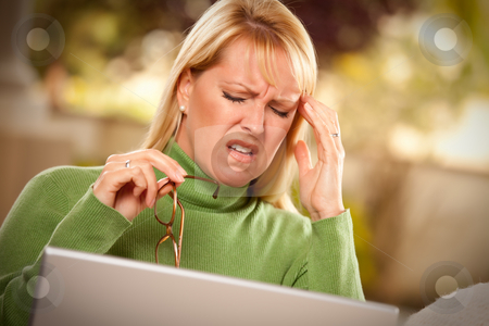 To use this stock image in your creative project, please select the size you need over to the right and click the "Add to Cart" button.
Your downloaded image will come with the Cutcaster watermark removed so don’t worry about the watermark you see on this page. Grimacing Woman Using laptop Suffering a Headache stock photo, Grimacing Woman with Glasses Using Laptop Suffering a Painful Headache. by Andy Dean