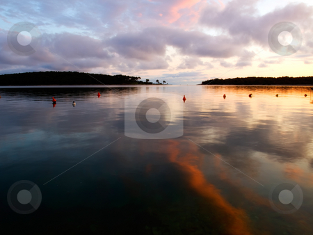 To use this stock image in your creative project, please select the size you need over to the right and click the "Add to Cart" button.
Your downloaded image will come with the Cutcaster watermark removed so don’t worry about the watermark you see on this page. Painted calm stock photo, Reflection of clouds and sunset on the quiet surface of the sea. by Sinisa Botas