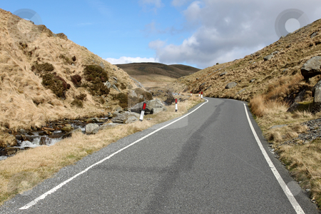 To use this stock image in your creative project, please select the size you need over to the right and click the "Add to Cart" button.
Your downloaded image will come with the Cutcaster watermark removed so don’t worry about the watermark you see on this page. Single lane narrow country to Cymystwyth in Wales UK. stock photo, Single lane narrow country to Cymystwyth in Wales UK. by Stephen Rees