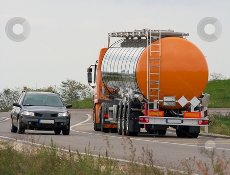 To use this stock image in your creative project, please select the size you need over to the right and click the "Add to Cart" button.
Your downloaded image will come with the Cutcaster watermark removed so don’t worry about the watermark you see on this page. Truck stock photo, Oil transporter truck driving on the road by P?