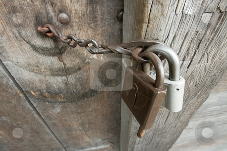 To use this stock image in your creative project, please select the size you need over to the right and click the "Add to Cart" button.
Your downloaded image will come with the Cutcaster watermark removed so don’t worry about the watermark you see on this page. Lock stock photo, Padlock on an old wooden barn door by P?
