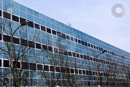 To use this stock image in your creative project, please select the size you need over to the right and click the "Add to Cart" button.
Your downloaded image will come with the Cutcaster watermark removed so don’t worry about the watermark you see on this page. Glass building stock photo, Front of an office buildung with many windows. Modern design by Paul Phillips