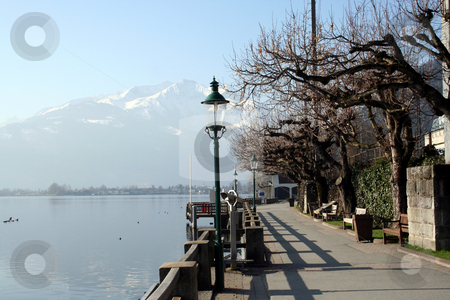 To use this stock image in your creative project, please select the size you need over to the right and click the "Add to Cart" button.
Your downloaded image will come with the Cutcaster watermark removed so don’t worry about the watermark you see on this page. Alpine lake stock photo, Scenic view of pathway around Alpine lake, Zeller See, Zell am Zee, Austria. by Martin Crowdy