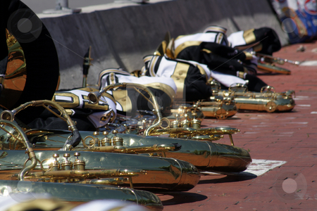 To use this stock image in your creative project, please select the size you need over to the right and click the "Add to Cart" button.
Your downloaded image will come with the Cutcaster watermark removed so don’t worry about the watermark you see on this page. Marching Band Instruments stock photo, Marching band horn instruments, neatly placed on a brick pavement along with the uniform jackets. by Carl Stewart