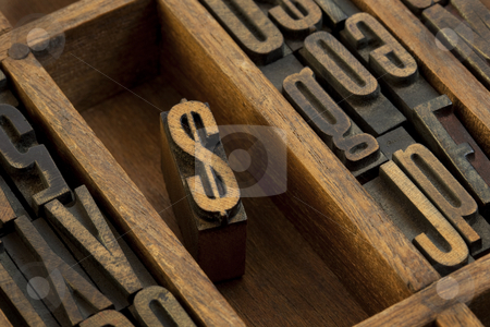 To use this stock image in your creative project, please select the size you need over to the right and click the "Add to Cart" button.
Your downloaded image will come with the Cutcaster watermark removed so don’t worry about the watermark you see on this page. Dollar - vintage letterpress wooden type stock photo, Financial or monetary concept, dollar symbol - vintage letterpress wooden type (condensed gothic) in old printer drawer among other letters stained by dark ink by Marek Uliasz
