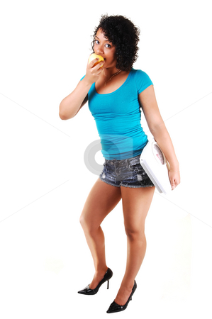 To use this stock image in your creative project, please select the size you need over to the right and click the "Add to Cart" button.
Your downloaded image will come with the Cutcaster watermark removed so don’t worry about the watermark you see on this page. Young girl with a scale. stock photo, A pretty Hispanic woman, eating an apple and caring a scale is proud
of her good figure and the wait she loosed, for white background. by Horst Petzold
