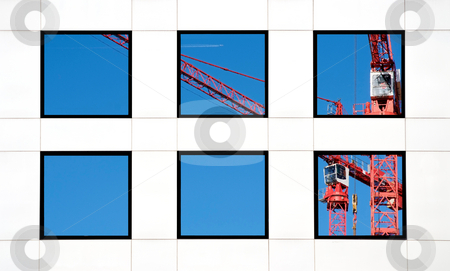 To use this stock image in your creative project, please select the size you need over to the right and click the "Add to Cart" button.
Your downloaded image will come with the Cutcaster watermark removed so don’t worry about the watermark you see on this page. Office block stock photo, Six windows in a white office block reflecting a crane by Paul Phillips