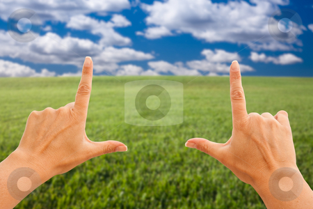 To use this stock image in your creative project, please select the size you need over to the right and click the "Add to Cart" button.
Your downloaded image will come with the Cutcaster watermark removed so don’t worry about the watermark you see on this page. Female Hands Making a Frame Over Grass and Sky stock photo, Female Hands Making a Frame Over Grass Field and Sky. by Andy Dean