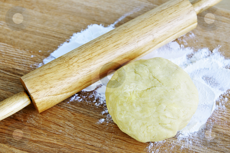 To use this stock image in your creative project, please select the size you need over to the right and click the "Add to Cart" button.
Your downloaded image will come with the Cutcaster watermark removed so don’t worry about the watermark you see on this page. Rolling pin and cookie dough stock photo, Wooden rolling pin and ball of cookie dough with flour by Elena Elisseeva