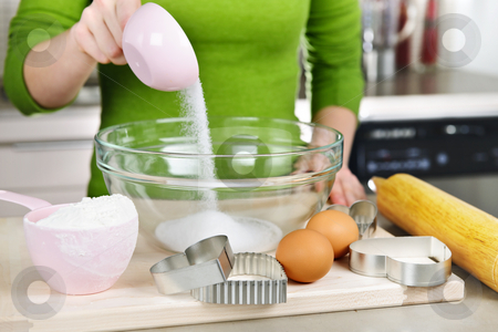 To use this stock image in your creative project, please select the size you need over to the right and click the "Add to Cart" button.
Your downloaded image will come with the Cutcaster watermark removed so don’t worry about the watermark you see on this page. Mixing ingredients for cookies stock photo, Pouring sugar into mixing bowl with ingredients for making cookies by Elena Elisseeva