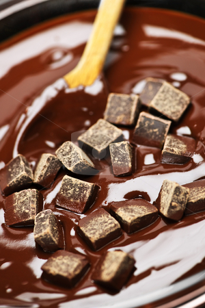 To use this stock image in your creative project, please select the size you need over to the right and click the "Add to Cart" button.
Your downloaded image will come with the Cutcaster watermark removed so don’t worry about the watermark you see on this page. Melting chocolate and spoon stock photo, Wooden spoon stirring melting rich chocolate chunks by Elena Elisseeva