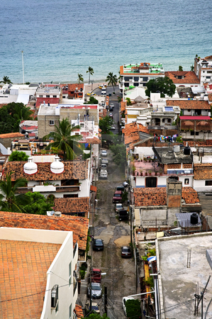 To use this stock image in your creative project, please select the size you need over to the right and click the "Add to Cart" button.
Your downloaded image will come with the Cutcaster watermark removed so don’t worry about the watermark you see on this page. City street in Puerto Vallarta, Mexico stock photo, View of street leading to Pacific ocean in Puerto Vallarta, Mexico by Elena Elisseeva