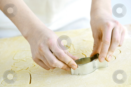 To use this stock image in your creative project, please select the size you need over to the right and click the "Add to Cart" button.
Your downloaded image will come with the Cutcaster watermark removed so don’t worry about the watermark you see on this page. Cookie cutter and dough stock photo, Cutting cookie shapes in rolled dough with cutter by Elena Elisseeva